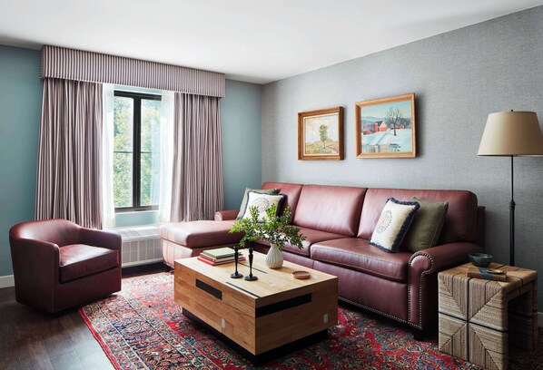 Suite, 1 King Bed with Sofa bed | Living area | 50-inch TV with cable channels