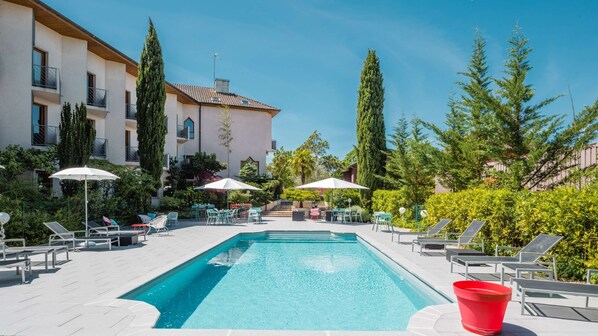 Outdoor pool, pool umbrellas, pool loungers