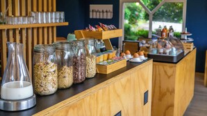 A breakfast bar with various food items and condiments. - Best Western Bridge Hotel Lyon East (Jons)