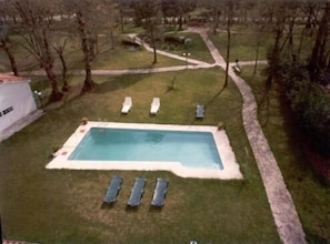 Seasonal outdoor pool, pool umbrellas, pool loungers