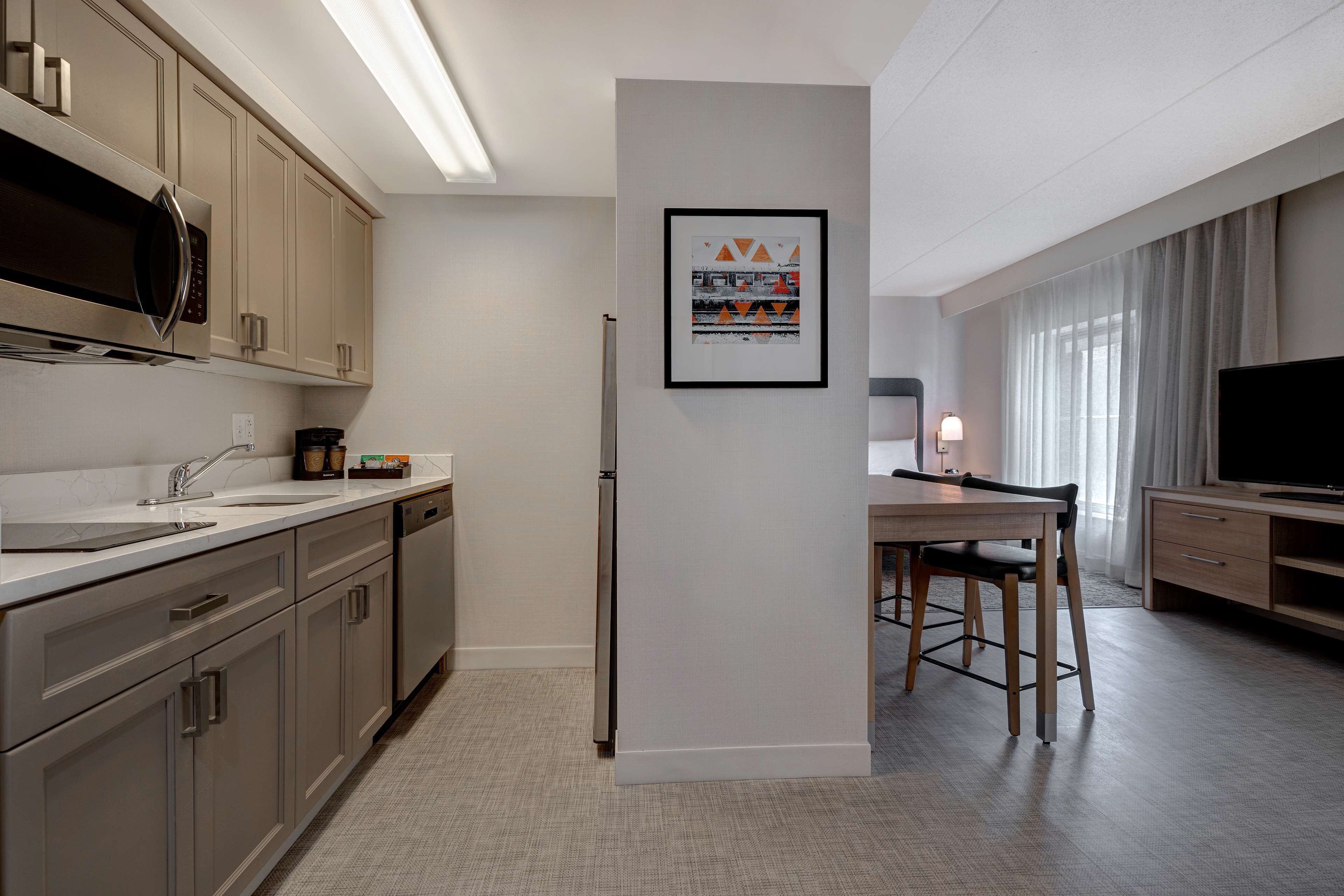 full-sized fridge, microwave, stovetop, dishwasher