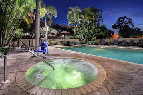 Outdoor pool, open 7 AM to 10 PM, pool umbrellas