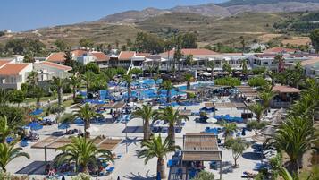 Indoor pool, seasonal outdoor pool, pool umbrellas, pool loungers