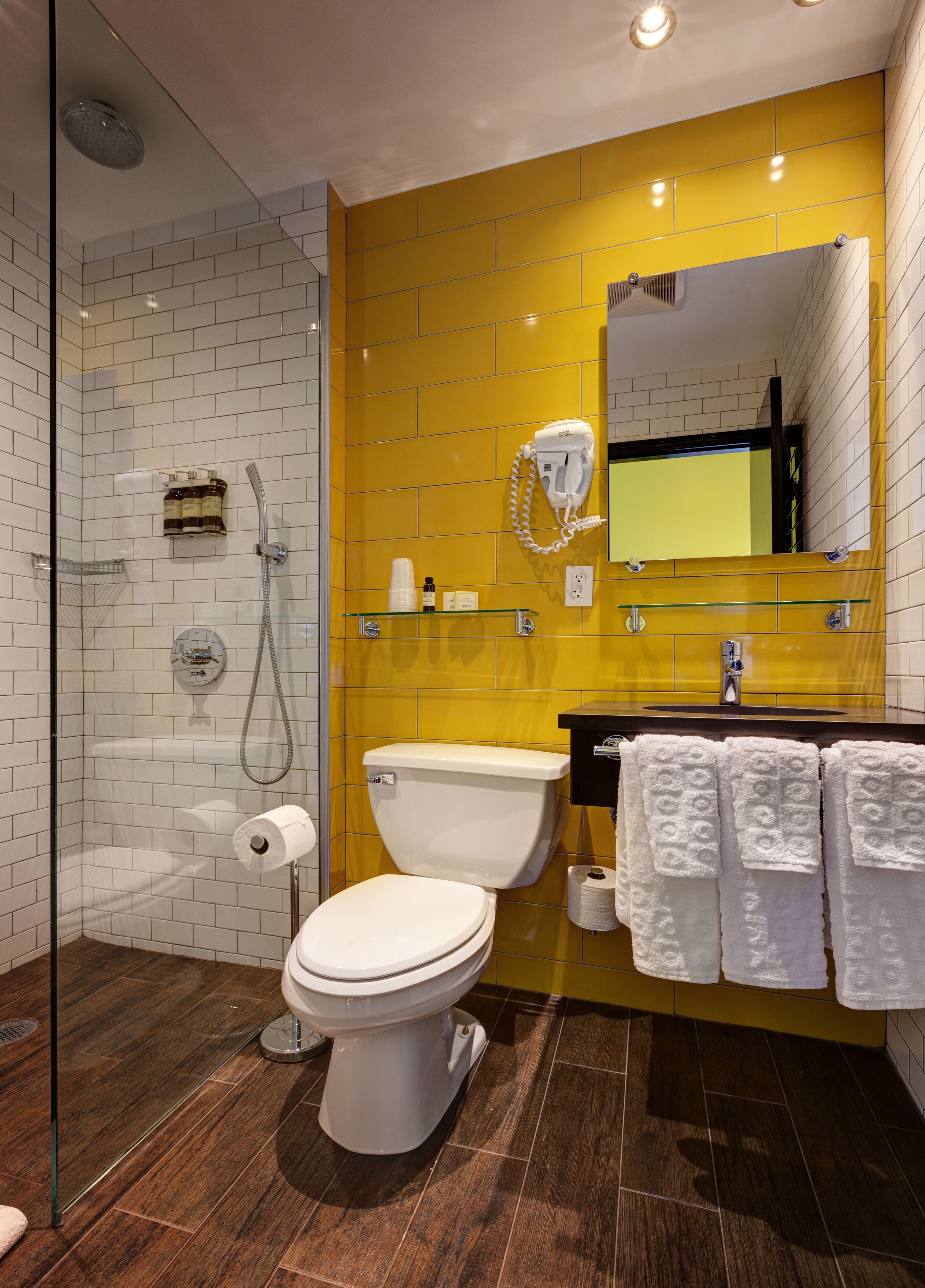 designer toiletries, hair dryer, towels, soap