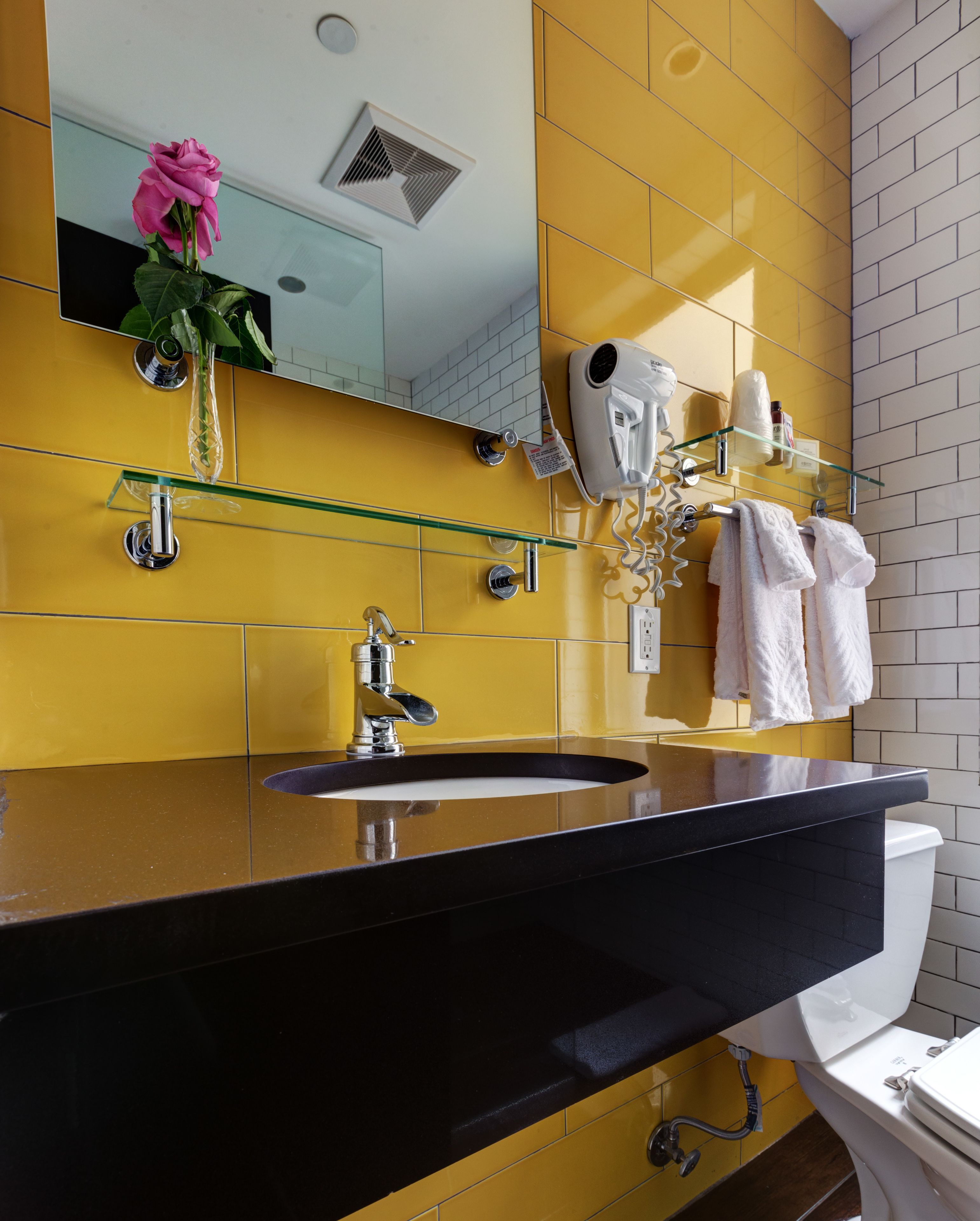 designer toiletries, hair dryer, towels, soap