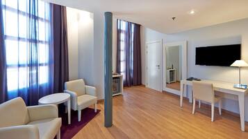 Luxe beddengoed, een minibar, een kluis op de kamer, een bureau