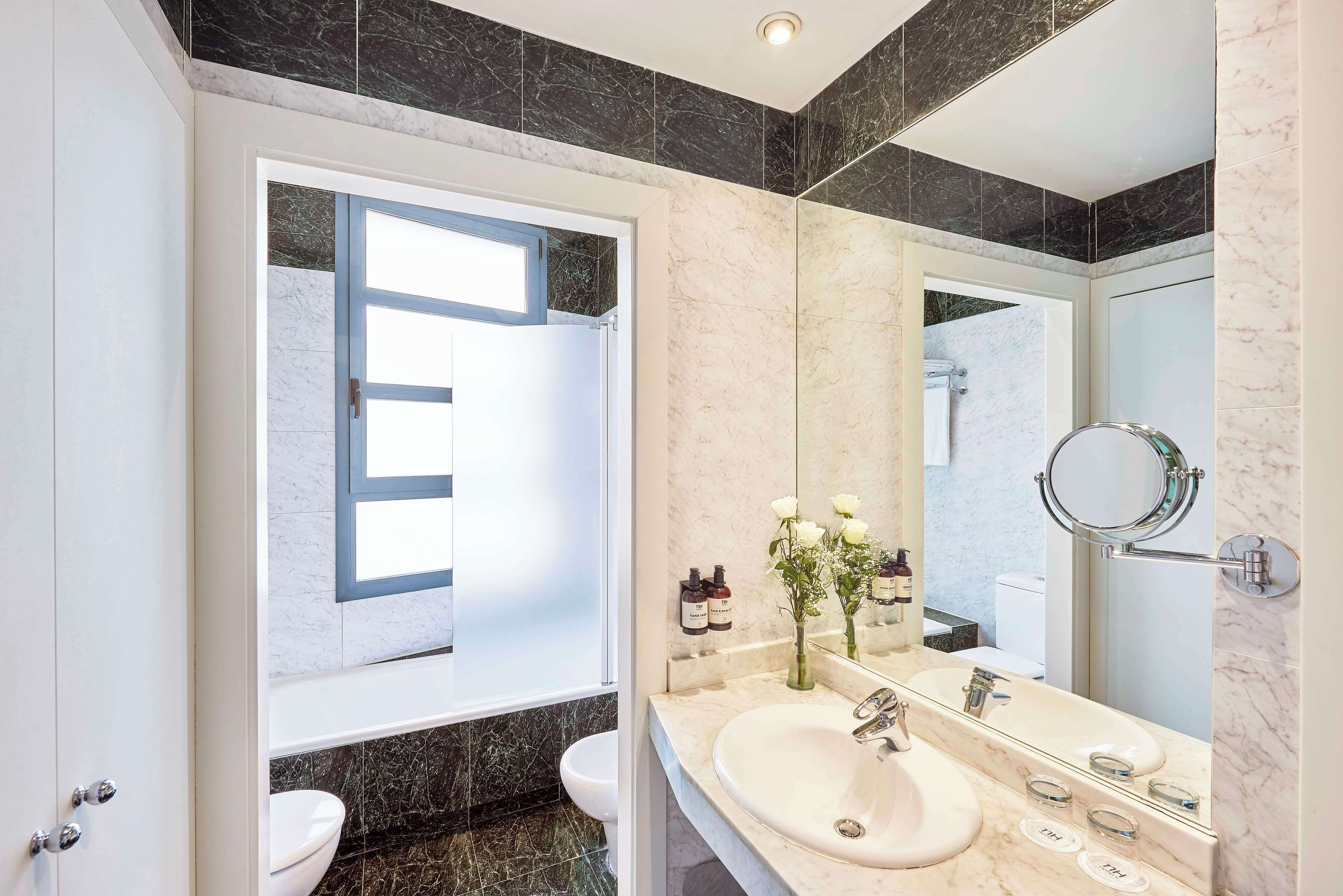 bathtub, deep-soaking bathtub, eco-friendly toiletries, hair dryer