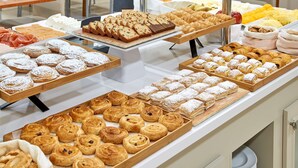 A buffet with various pastries and desserts. - NH Valencia Las Ciencias Hotel (Valencia)