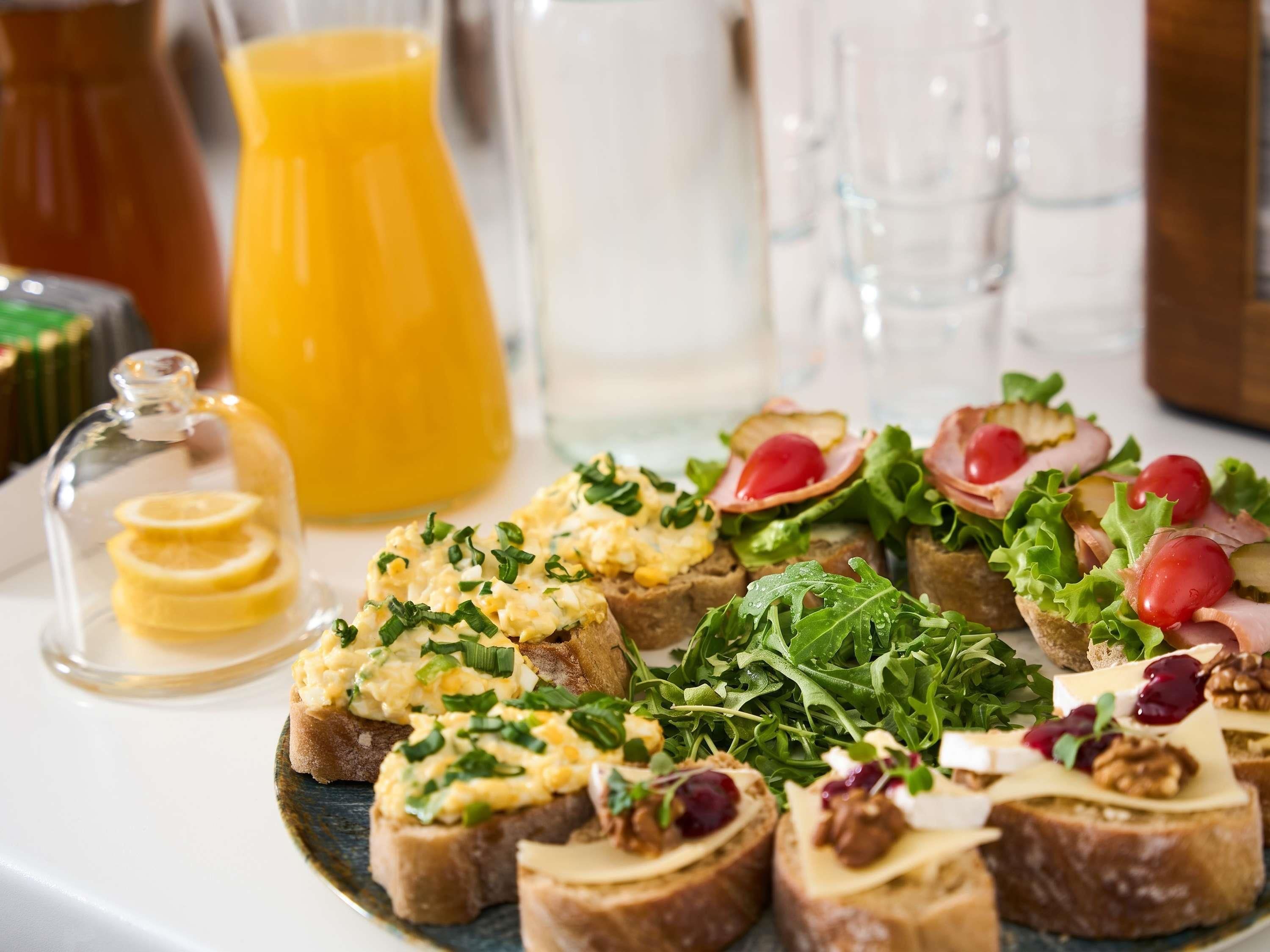 A breakfast spread with toast, eggs, cheese, and greens.