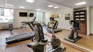A gym with treadmills, elliptical machines, and free weights. - Comfort Inn Columbus near Fort Benning (Columbus)