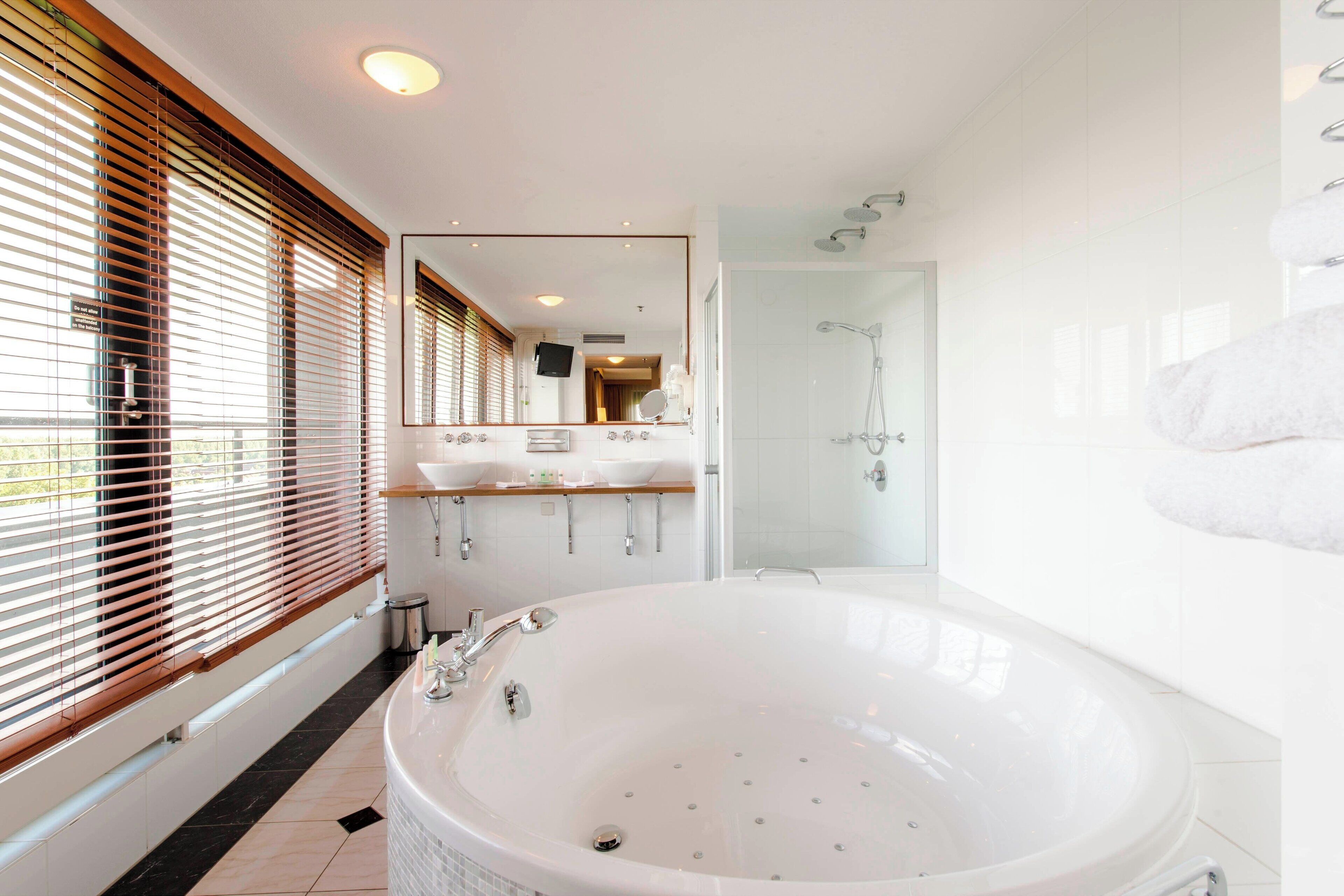 penthouse, 1 king bed, non smoking | bathroom | free toiletries, hair dryer, towels, soap