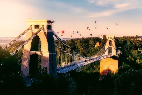 A suspension bridge with a tower structure, surrounded by greenery and a clear sky. - Hilton Garden Inn Bristol City Centre (Bristol)