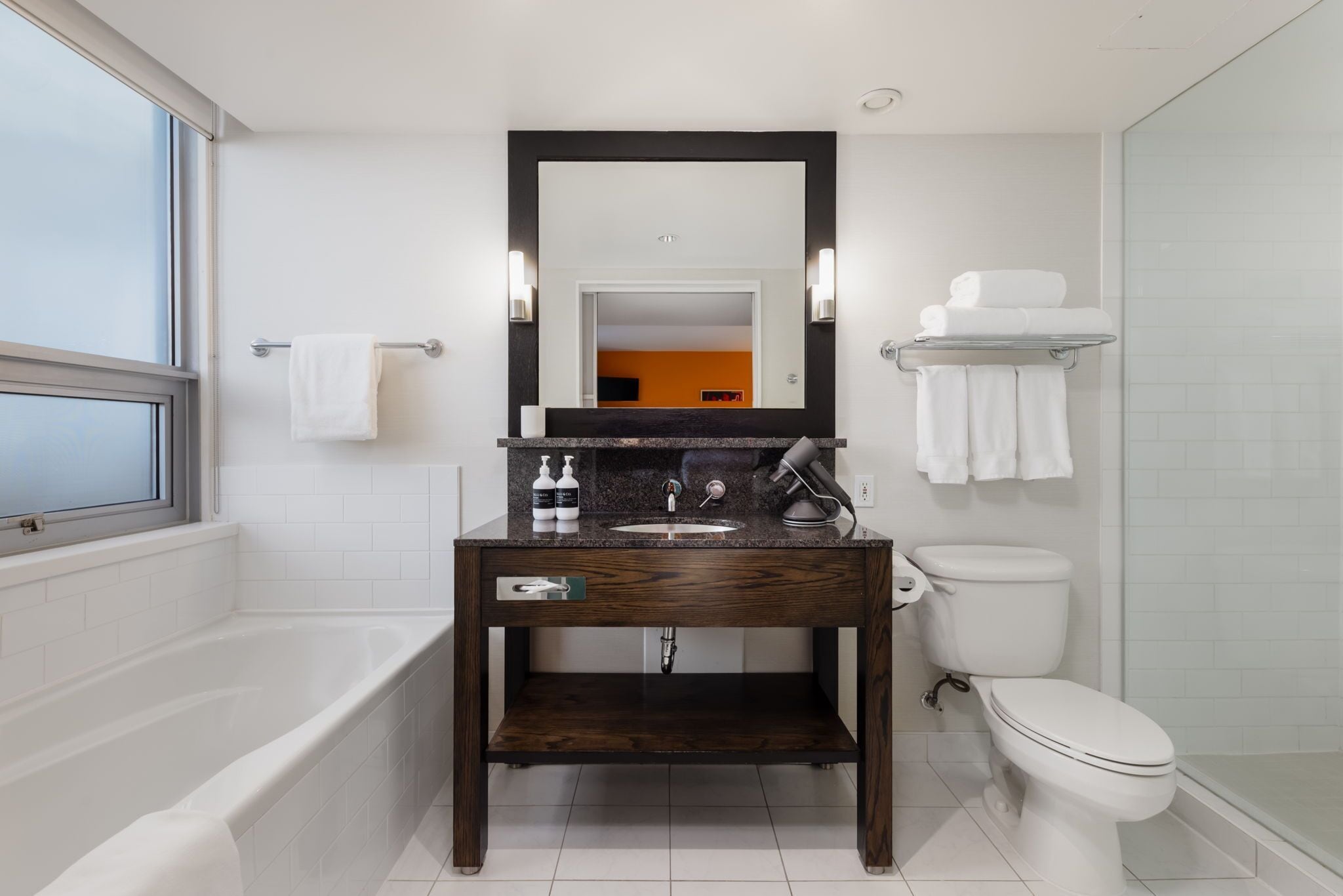 designer toiletries, hair dryer, bathrobes, slippers