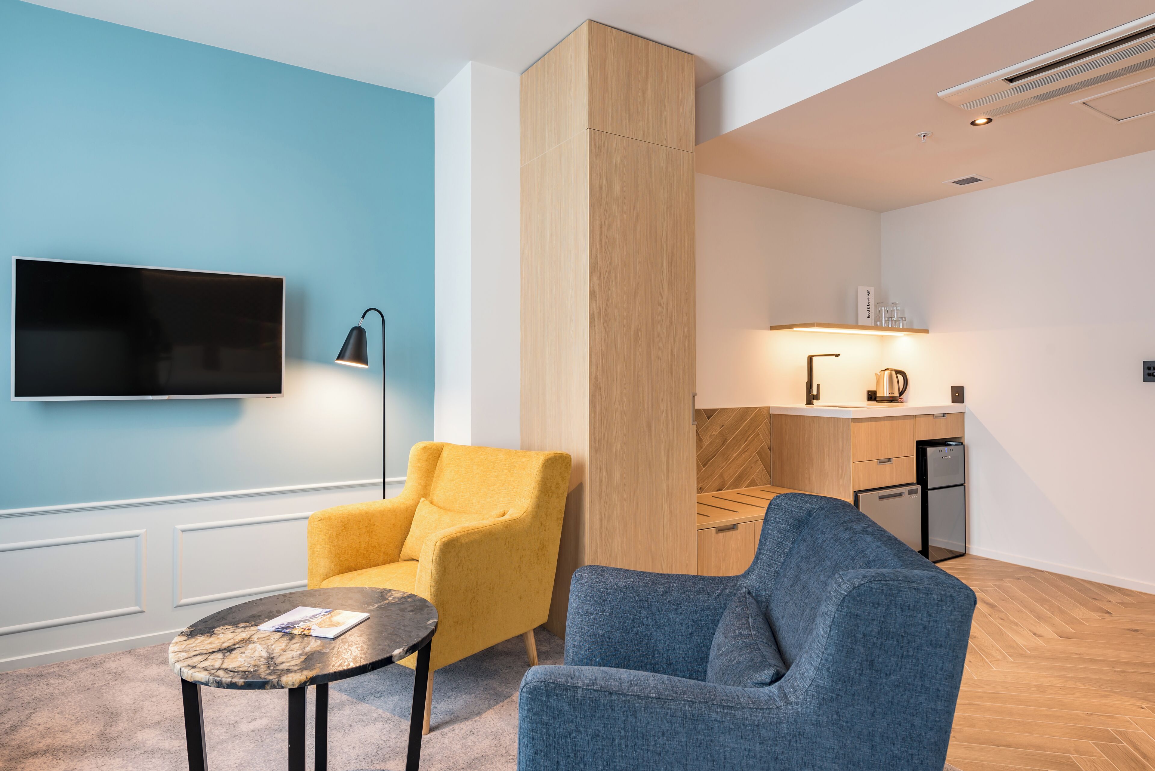 junior suite, 1 king bed | living area | 40-inch tv with satellite channels