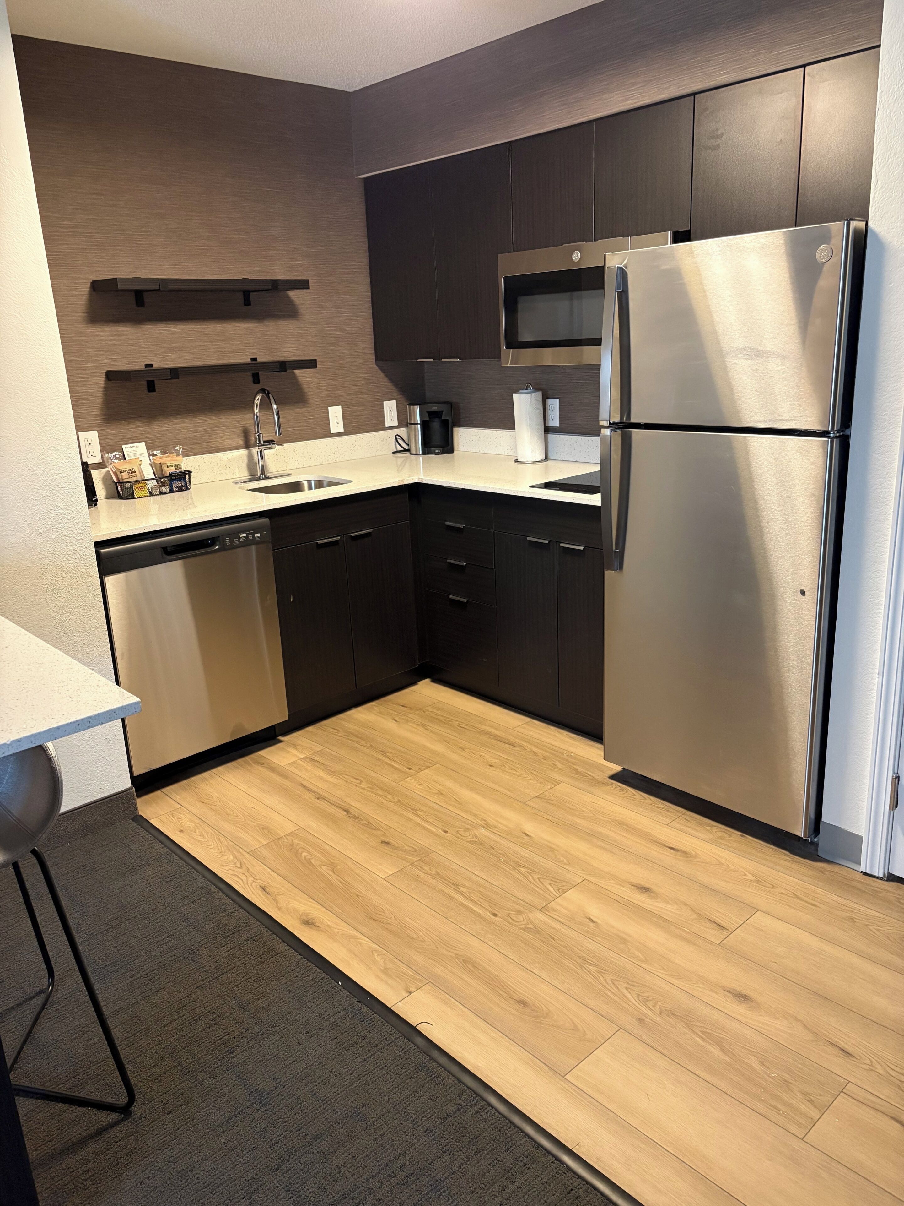 Fridge, microwave, coffee/tea maker, cookware/dishes/utensils