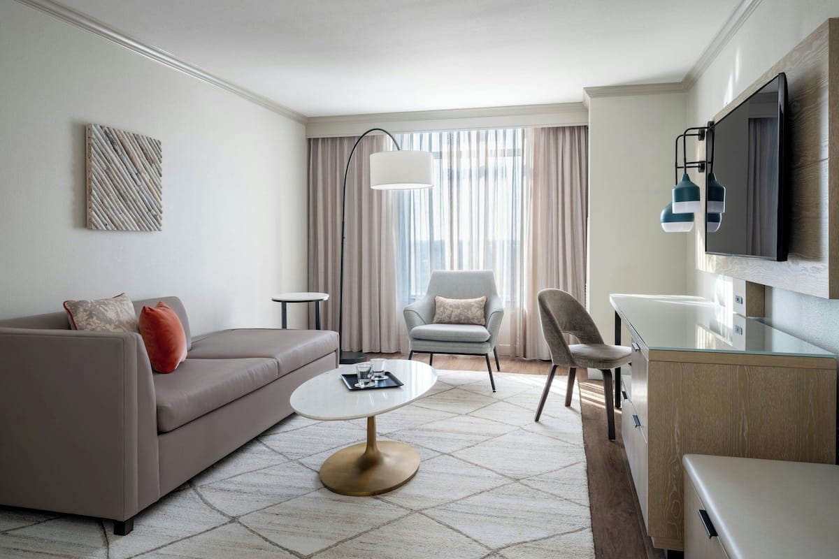 Suite, 1 Bedroom | Living room | 50-inch flat-screen TV with cable channels, TV