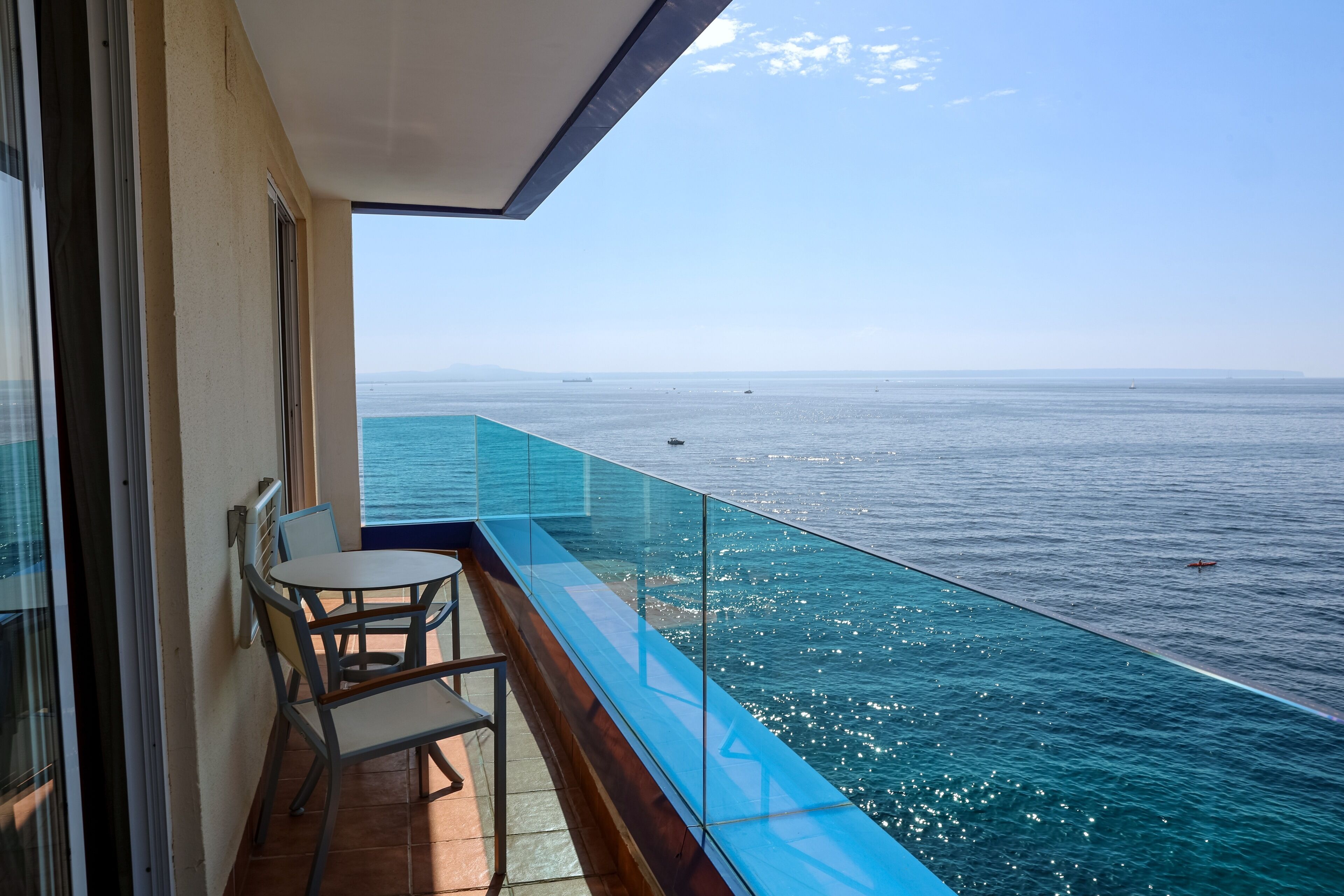 junior suite, sea view | 1 bedroom, in-room safe, desk, blackout curtains