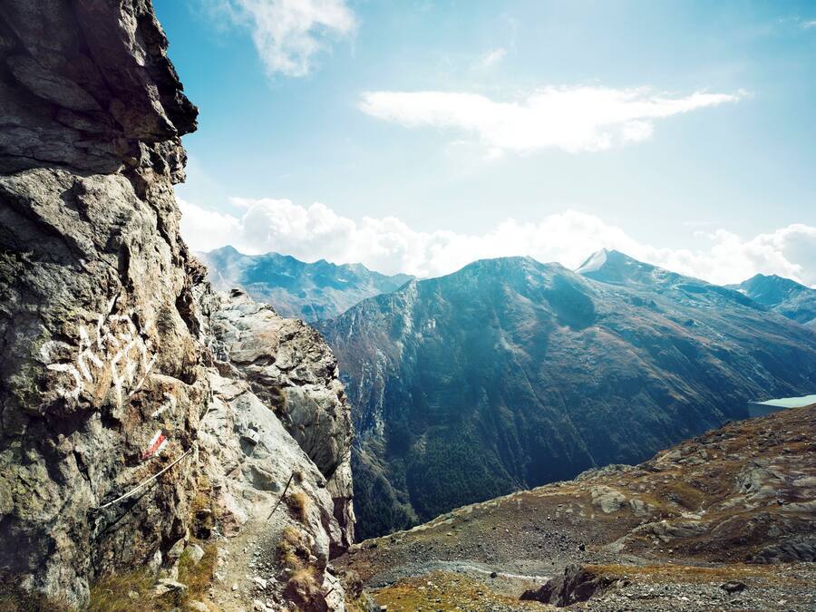 A mountainous landscape with rocky terrain and a clear sky.