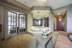 Deluxe King Suite with Jetted Tub-Separate Living Room | In-room safe, desk, blackout drapes, iron/ironing board