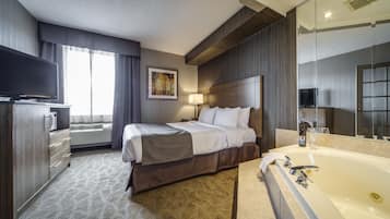 Deluxe Queen Suite with Jetted Tub-Separate Living Room | In-room safe, desk, blackout curtains, iron/ironing board