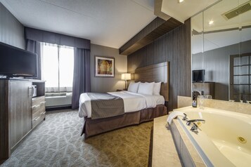 Deluxe Queen Suite with Jetted Tub-Separate Living Room | In-room safe, desk, blackout drapes, iron/ironing board