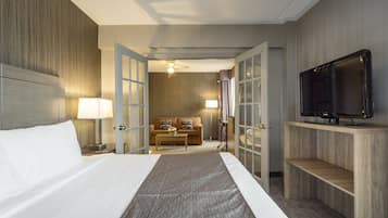 Deluxe King Suite with Jetted Tub-Separate Living Room | In-room safe, desk, blackout drapes, iron/ironing board