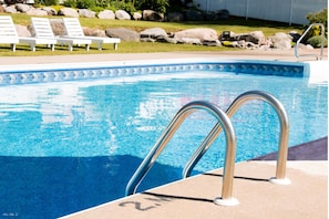 Seasonal outdoor pool, pool loungers