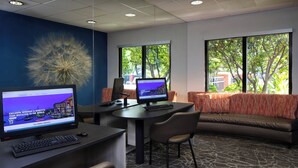 A modern office space with two desks, a sofa, and a decorative plant. - SpringHill Suites by Marriott Tampa Westshore Airport (Tampa)