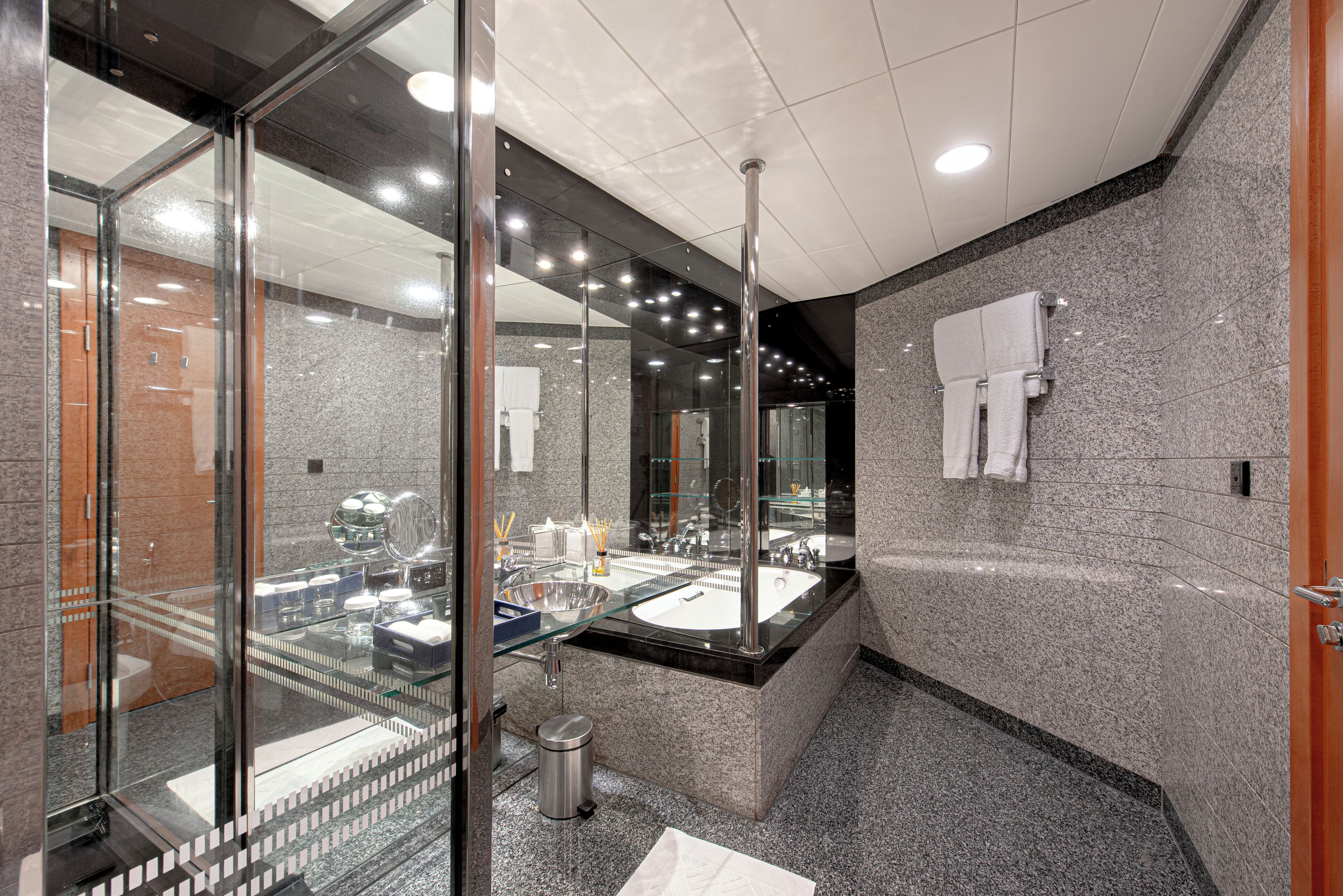 separate bathtub and shower, rainfall showerhead, designer toiletries