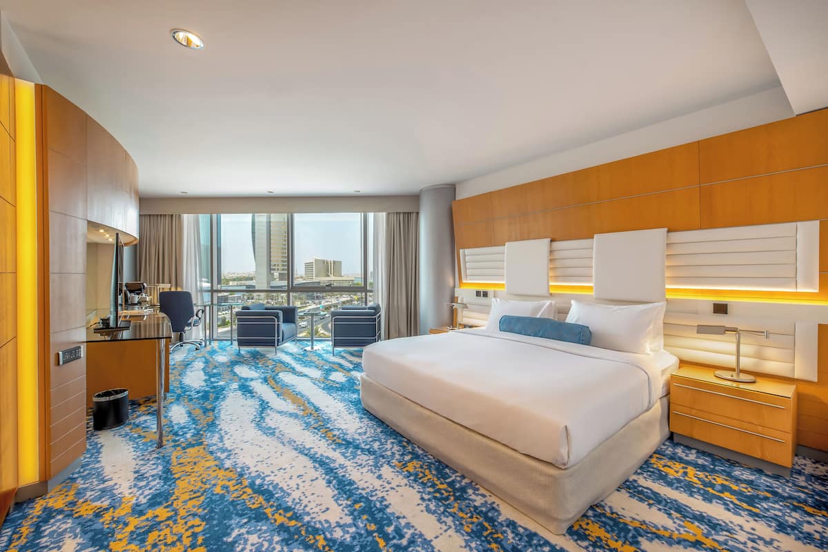 Deluxe Room, 1 King Bed | Hypo-allergenic bedding, in-room safe, individually decorated, desk