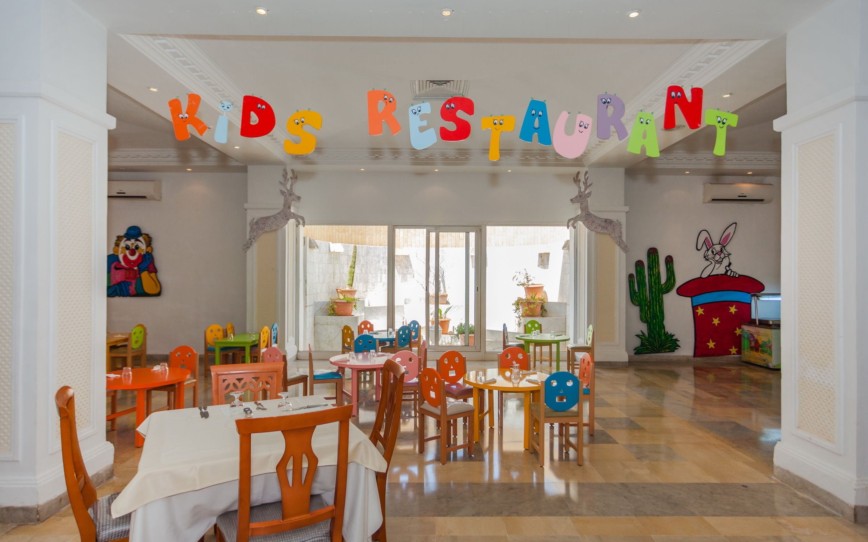 A children's restaurant with colorful furniture and playful decorations.