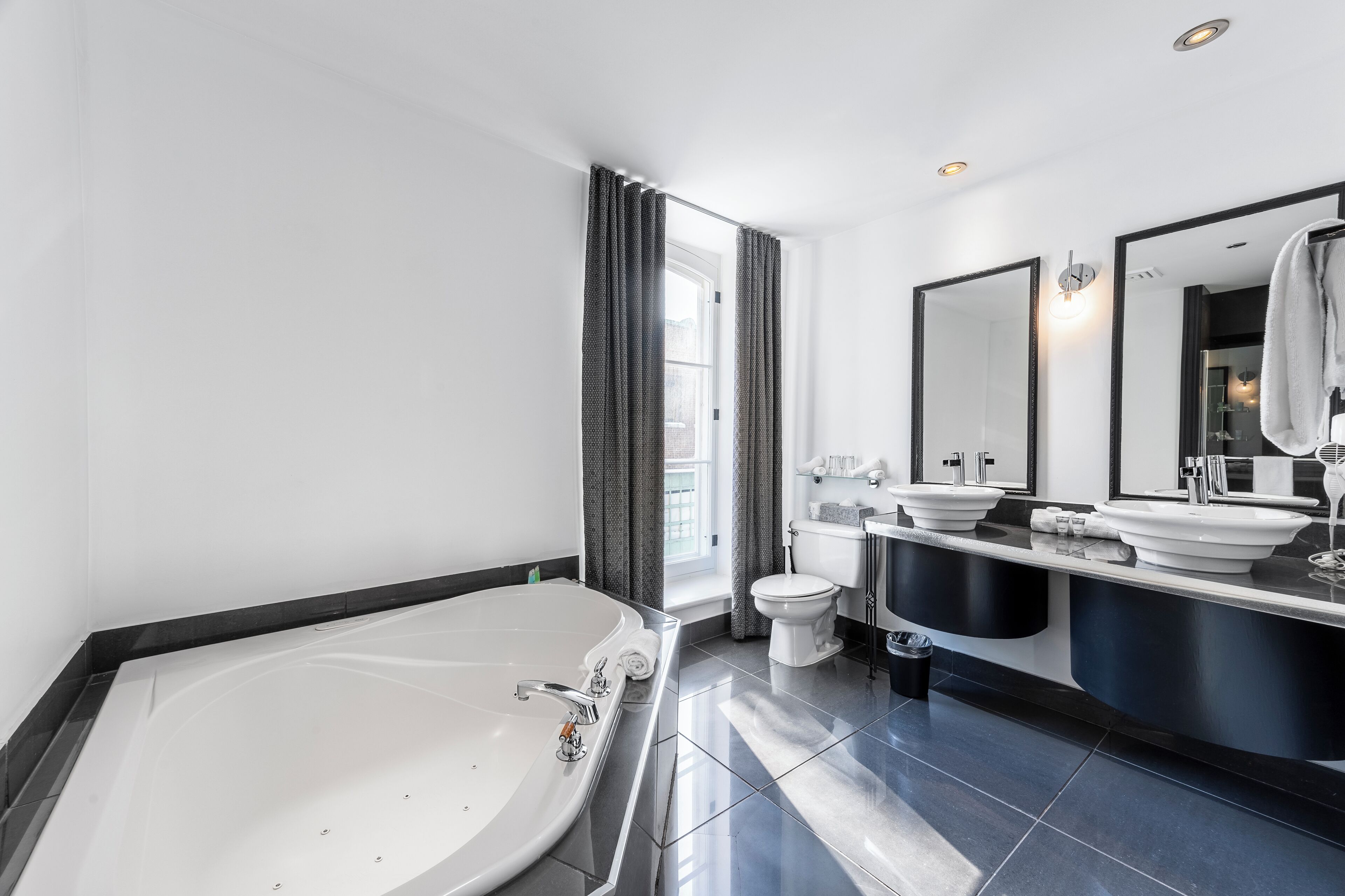 executive suite | bathroom | shower, free toiletries, hair dryer, towels