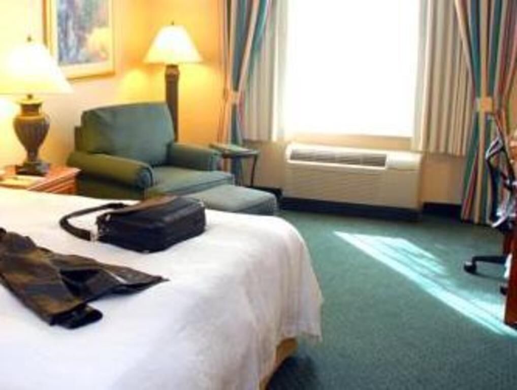 Premium bedding, desk, laptop workspace, blackout curtains