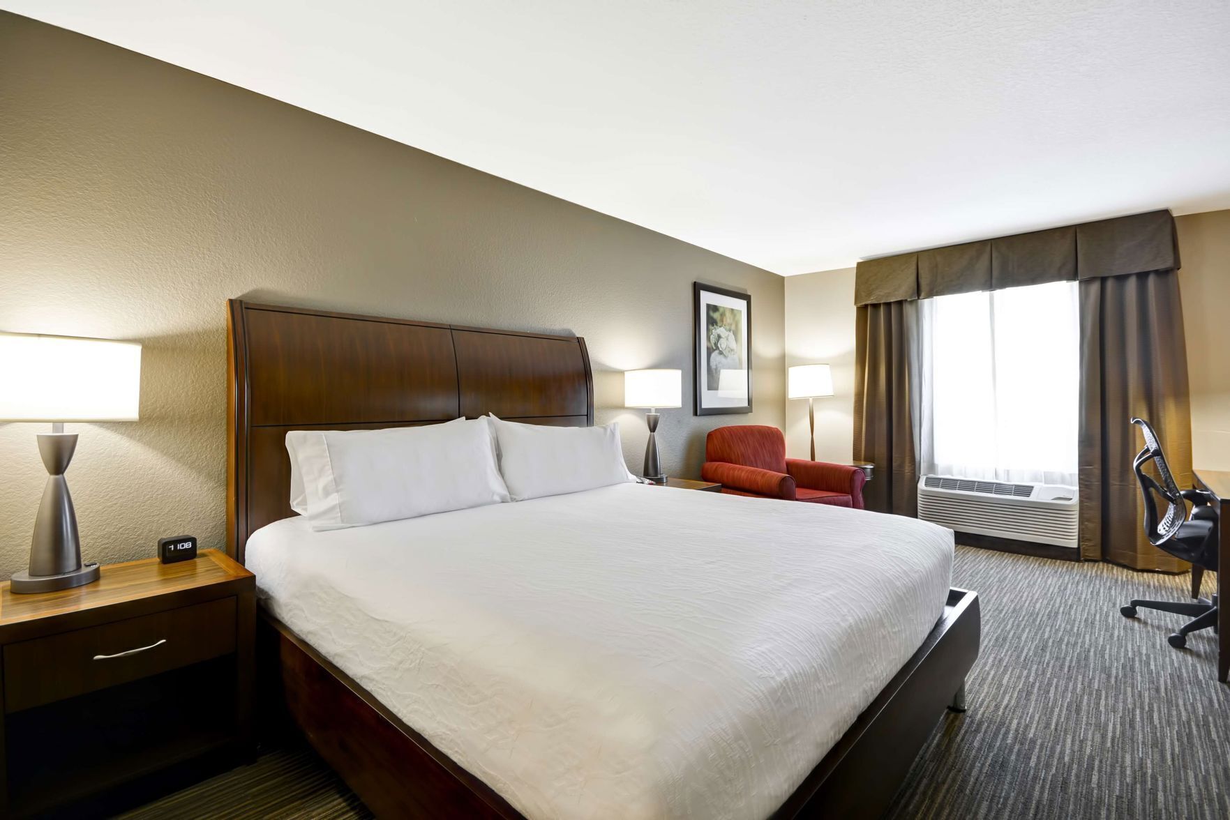 Premium bedding, desk, laptop workspace, blackout curtains