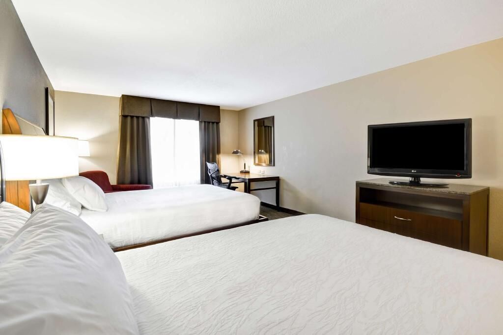 Premium bedding, desk, laptop workspace, blackout curtains