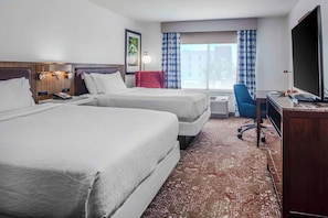 Premium bedding, desk, laptop workspace, blackout curtains