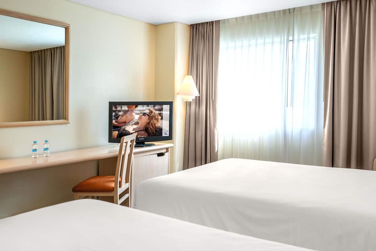 Standard Room, 2 Double Beds | In-room safe, desk, laptop workspace, blackout drapes
