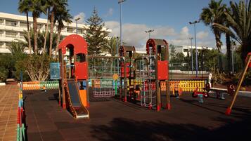 Children can play on the slide and climbing frames in this secure outdoor playground.