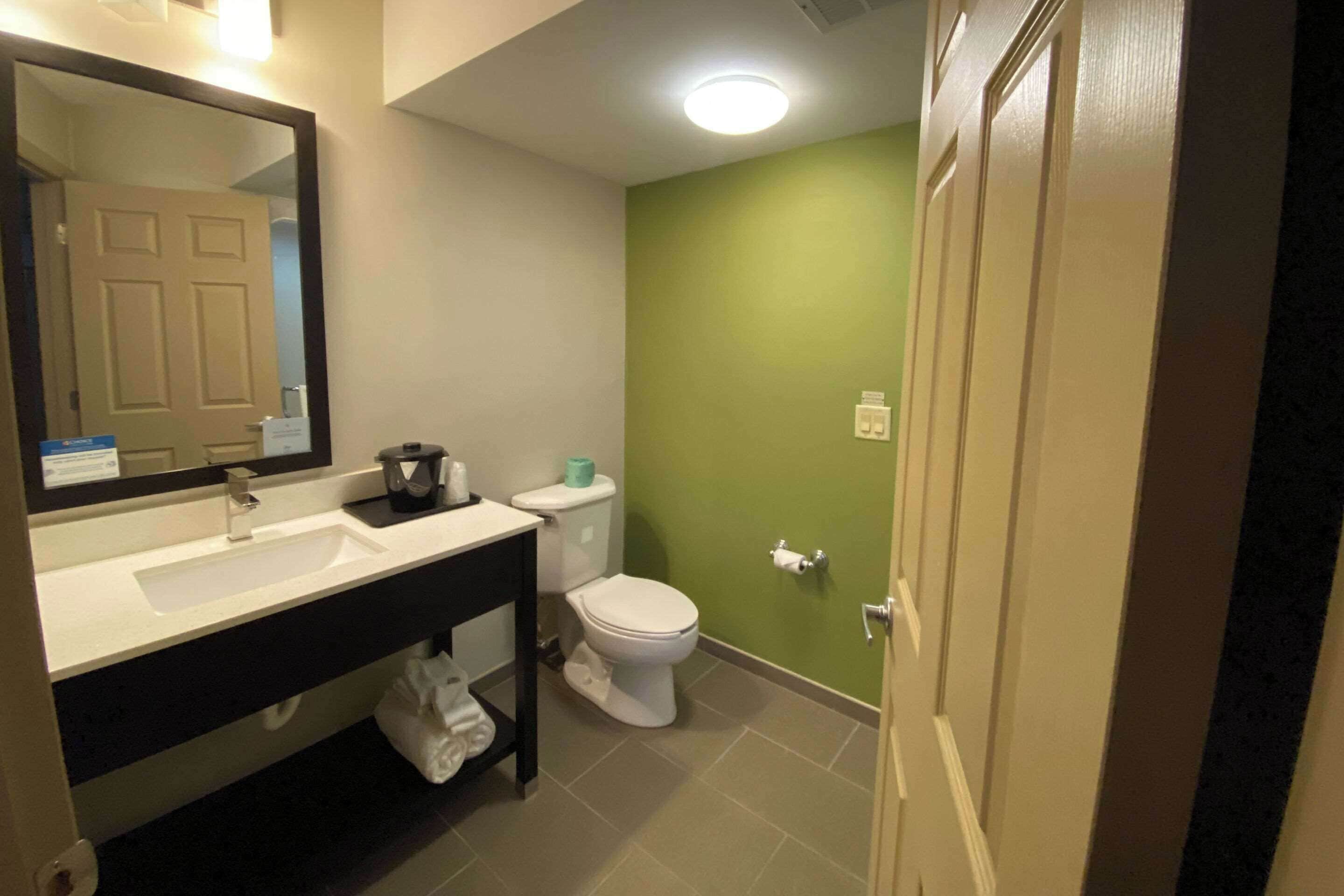 desk, laptop workspace, blackout curtains, iron/ironing board