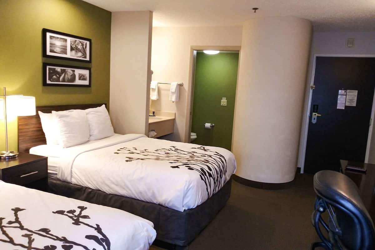 Desk, laptop workspace, blackout drapes, iron/ironing board