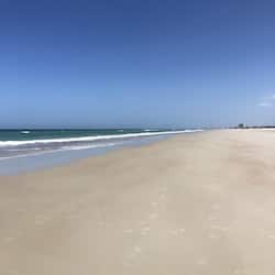 On the beach, white sand, beach towels