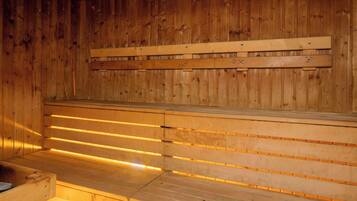 A sauna with wooden benches and slatted walls.