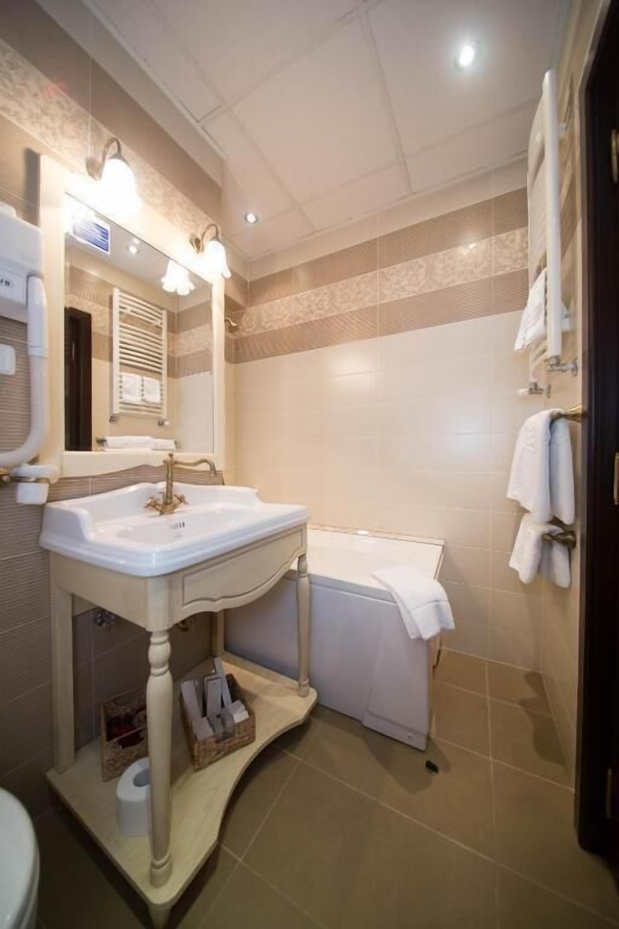 suite, 1 queen bed, non smoking, bathtub | bathroom | hair dryer, slippers, towels