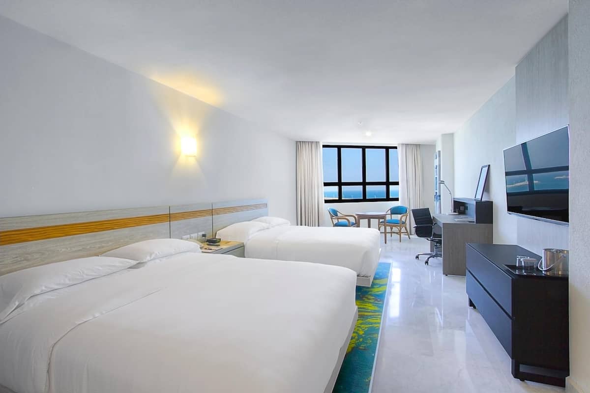 Premium bedding, down duvets, pillow-top beds, in-room safe
