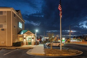 A building with a sign reading 'Home Town Studios' and an American flag.