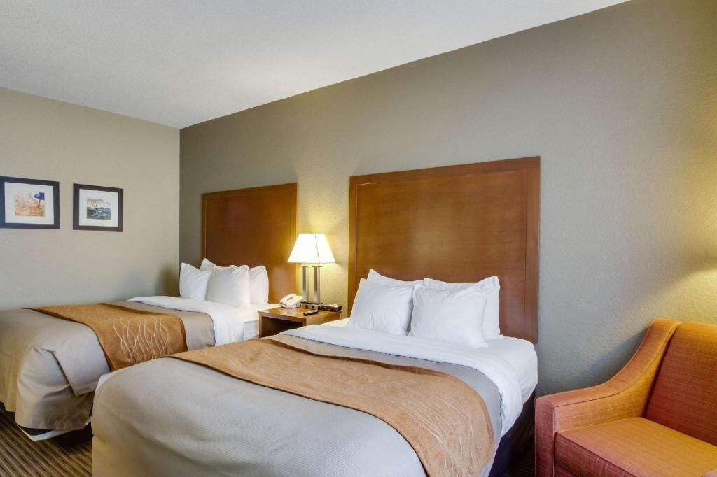 Pillowtop beds, desk, blackout drapes, iron/ironing board