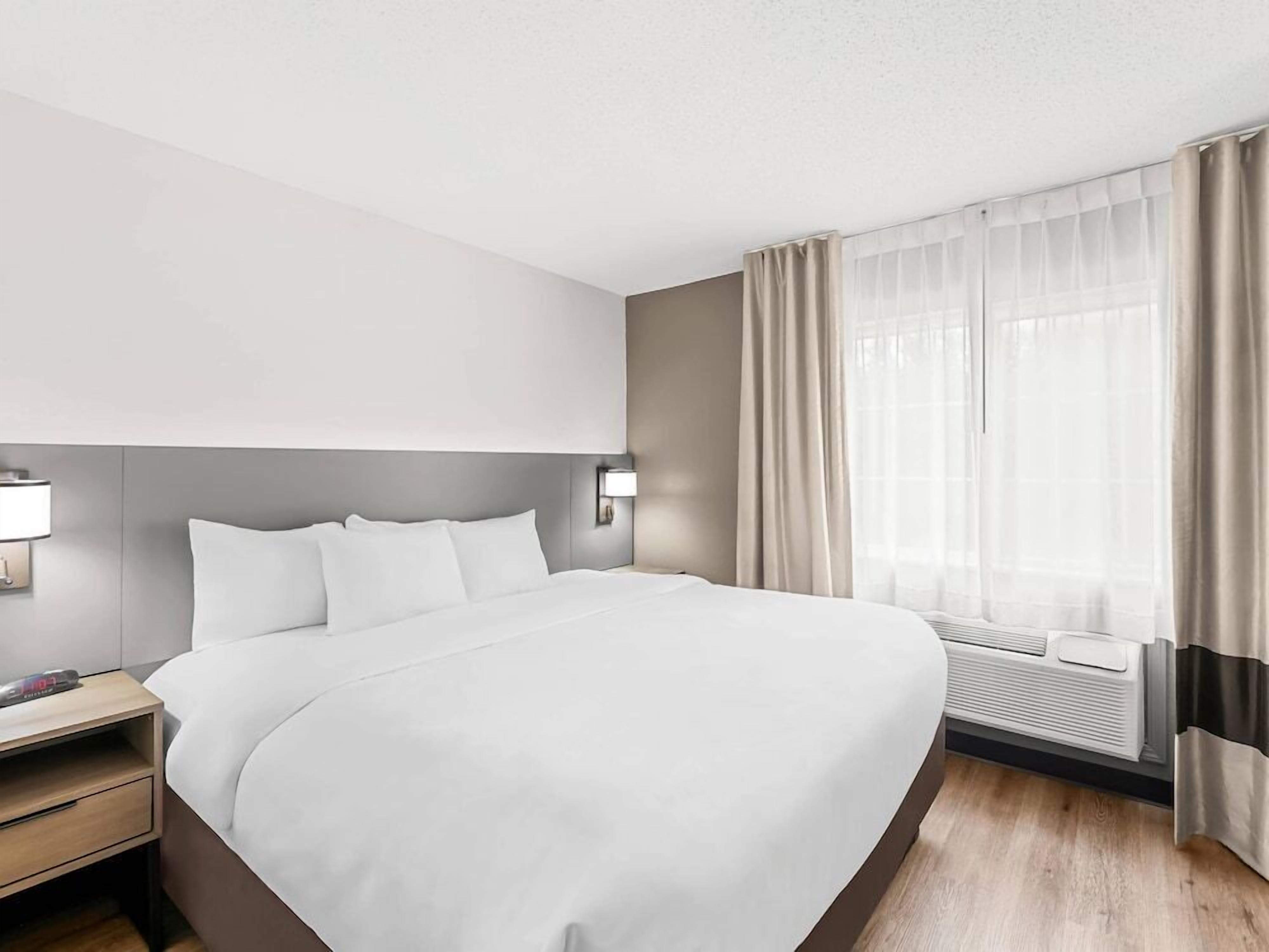Pillowtop beds, desk, blackout drapes, iron/ironing board