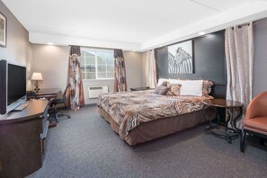 Desk, laptop workspace, blackout drapes, iron/ironing board