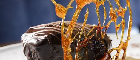 A dessert with chocolate and caramel on a plate.