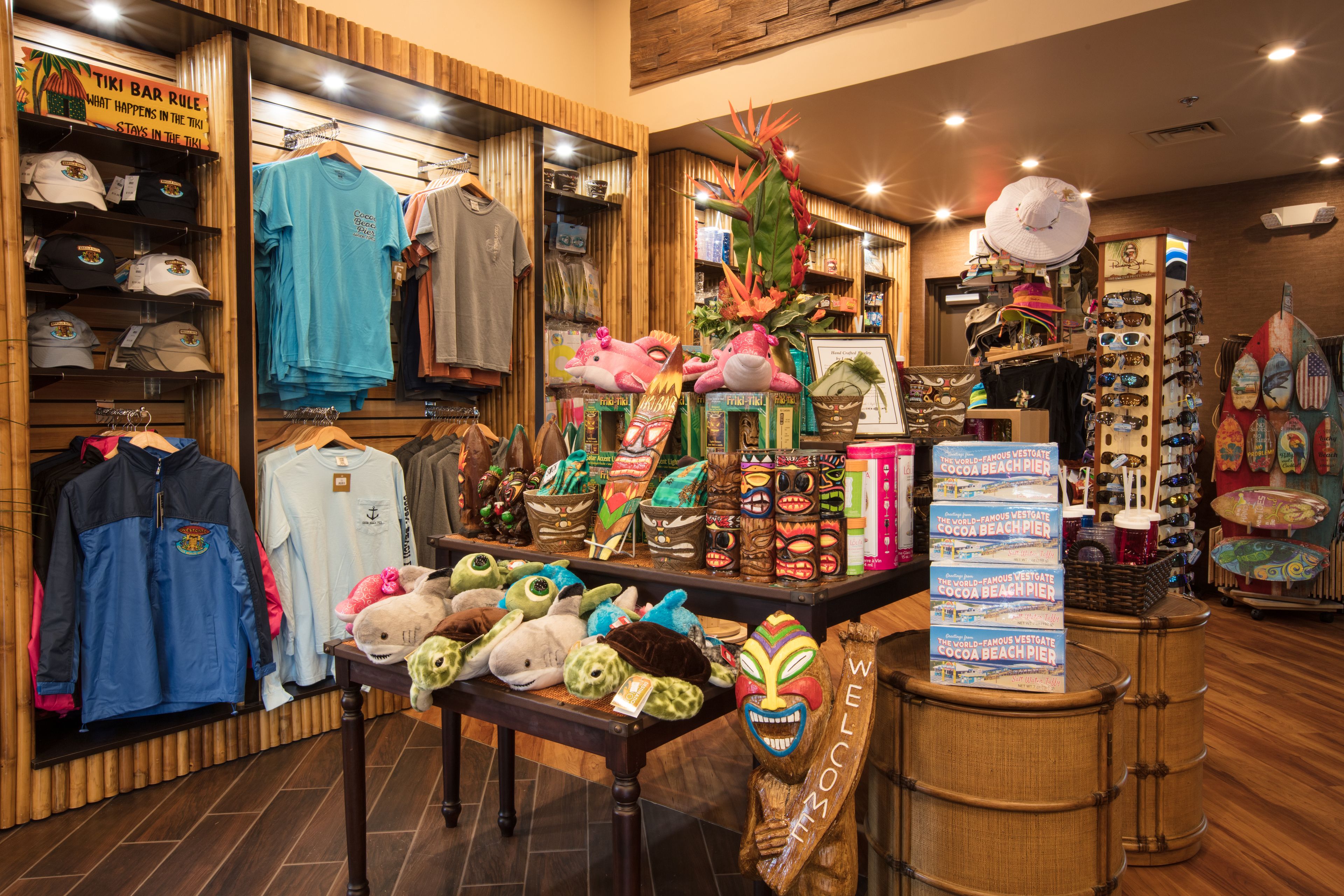A store with various items including hats, t-shirts, and plush toys.